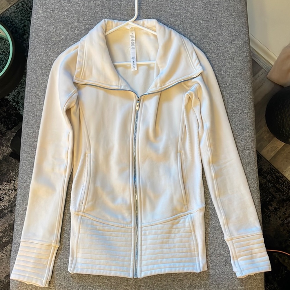 Cream colored in good condition Lululemon jacket.